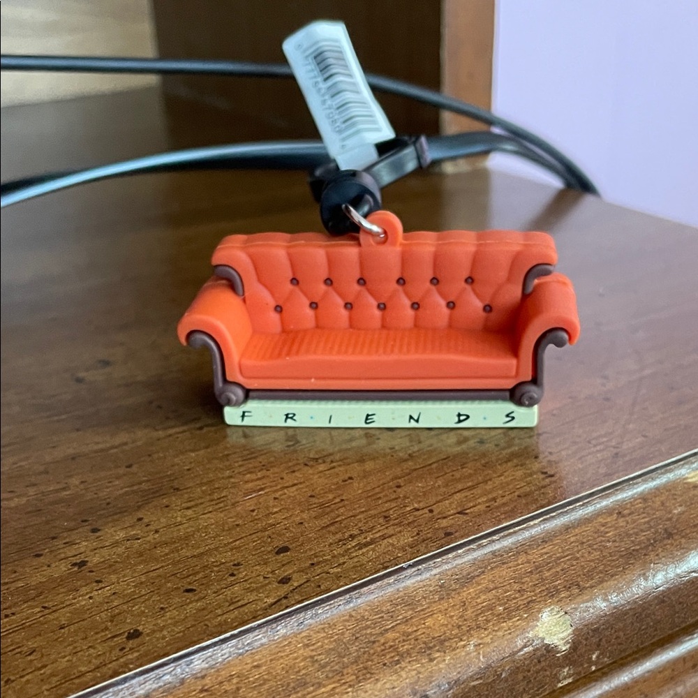 Friends Orange Couch Keychain with Friends Logo
